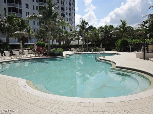 view of swimming pool with a patio area