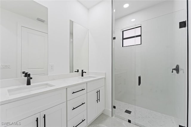 bathroom with vanity and walk in shower