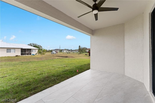 view of patio featuring ceiling fan