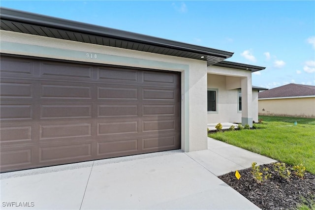 garage with a yard