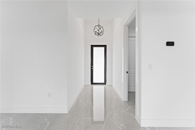 entryway featuring a chandelier