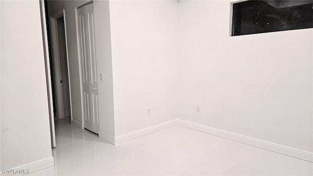 empty room with light tile patterned floors