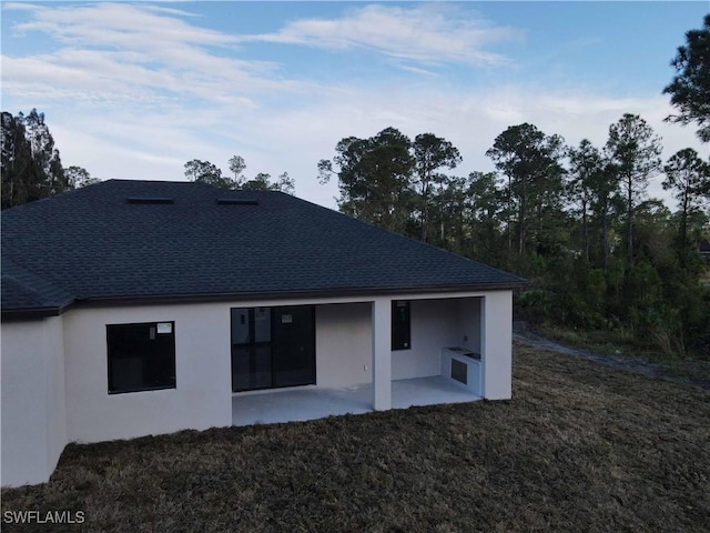 rear view of house with a patio