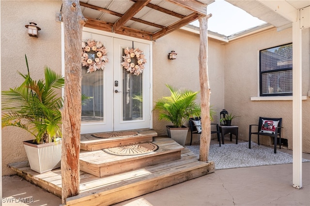 property entrance featuring french doors