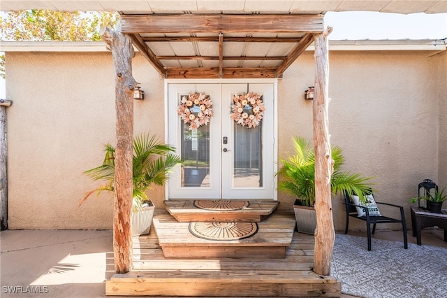 doorway to property featuring french doors