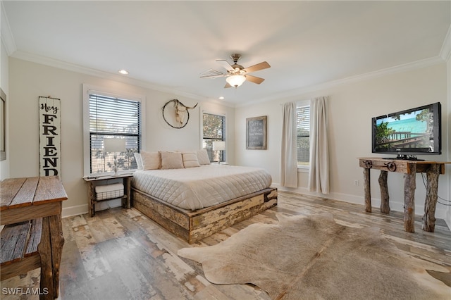 bedroom with ceiling fan, ornamental molding, and light hardwood / wood-style flooring