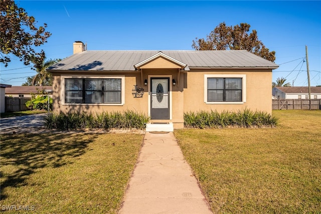 bungalow-style house with a front yard