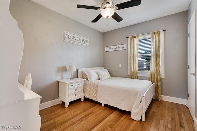 bedroom with light wood-type flooring and ceiling fan