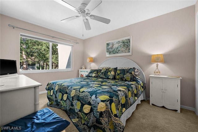 bedroom with light carpet and ceiling fan