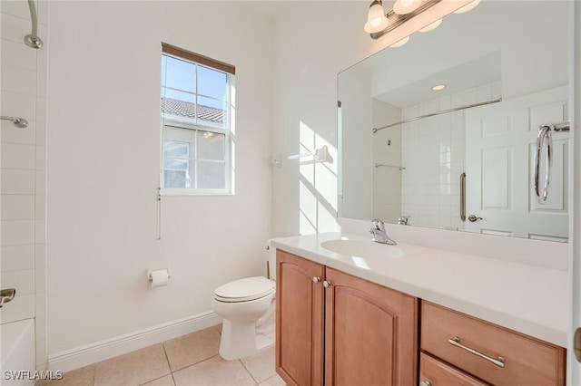 full bathroom with tile patterned floors, vanity, toilet, and tiled shower / bath combo