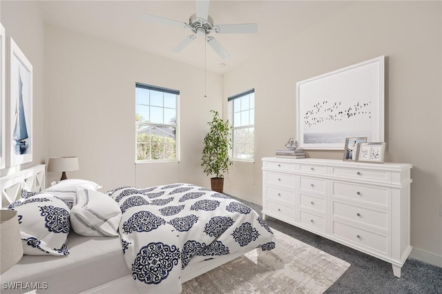 carpeted bedroom with ceiling fan