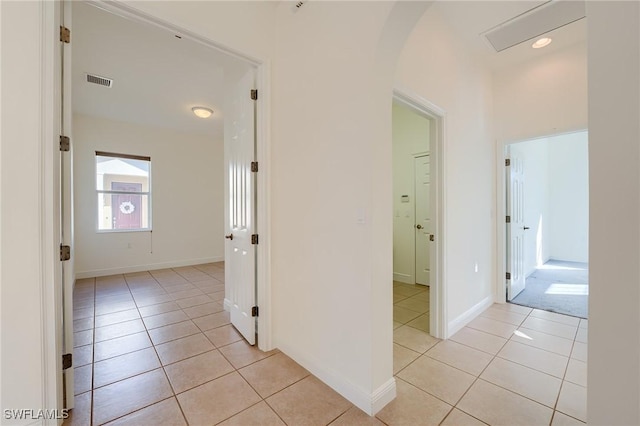 hallway featuring light tile patterned floors