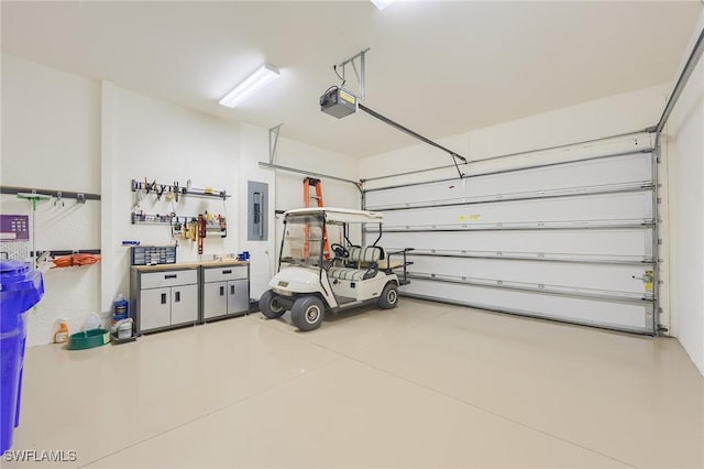 garage featuring electric panel and a garage door opener