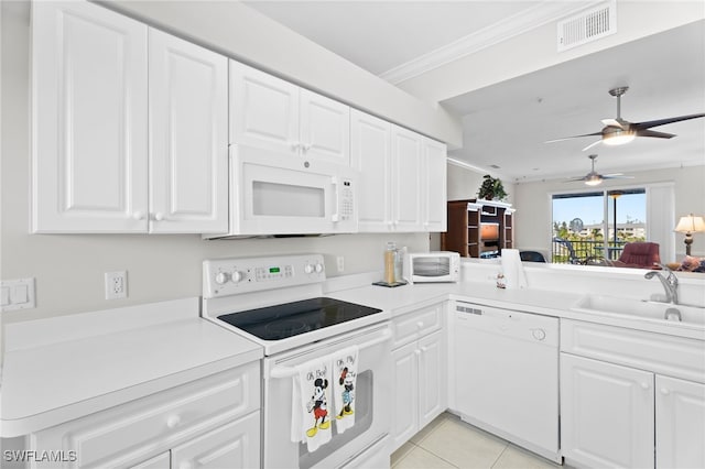 kitchen with ornamental molding, white appliances, visible vents, ceiling fan, and a sink