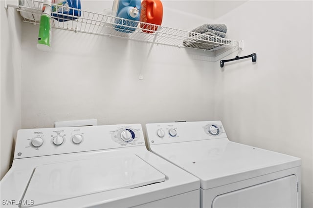laundry room featuring washer and clothes dryer and laundry area