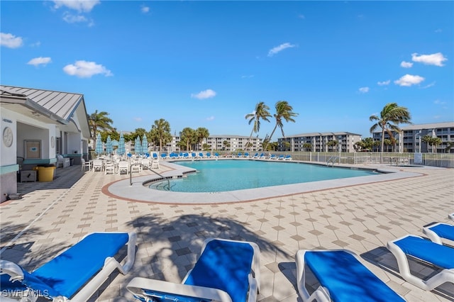 view of swimming pool with a patio