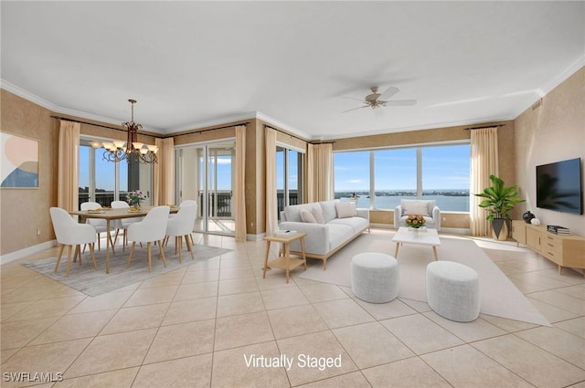 living area featuring crown molding, light tile patterned floors, and ceiling fan with notable chandelier