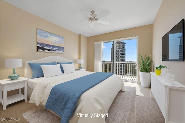 bedroom with access to exterior, carpet flooring, and ceiling fan