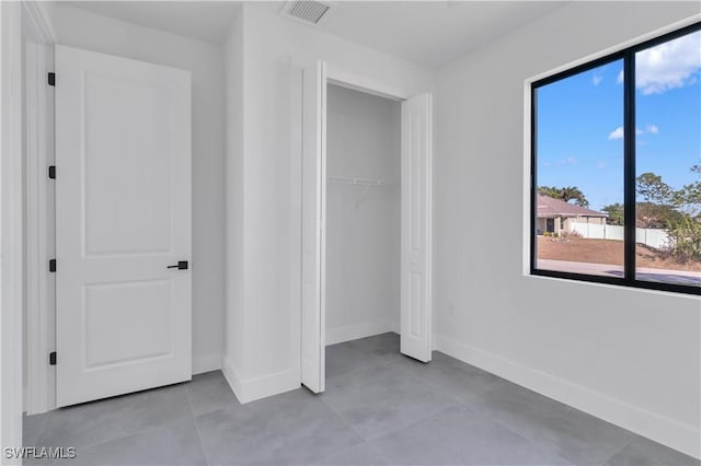 unfurnished bedroom featuring a closet