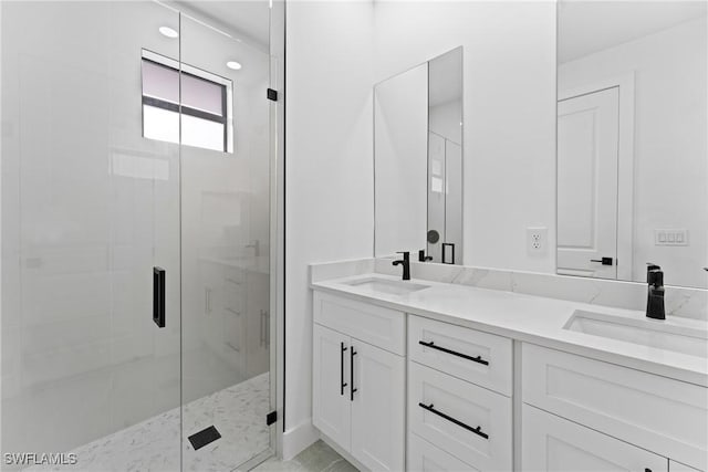 bathroom with vanity and a shower with shower door