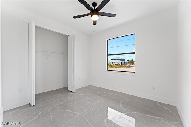 unfurnished bedroom featuring a closet and ceiling fan