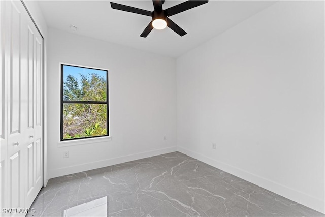 spare room with ceiling fan