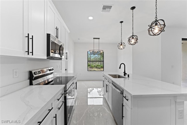 kitchen with white cabinets, stainless steel appliances, and sink