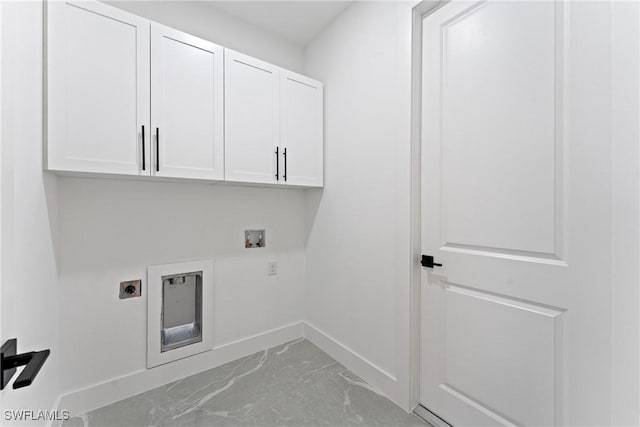 laundry room with cabinets, washer hookup, and electric dryer hookup