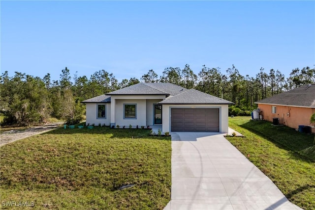 view of front of house featuring a front yard and a garage