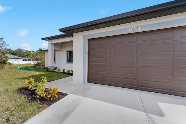 garage with a yard