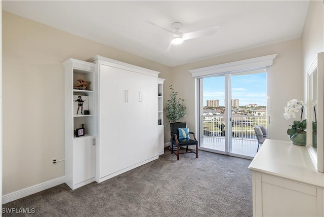 sitting room with carpet floors and ceiling fan