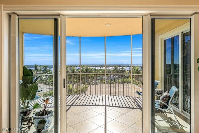 doorway to outside featuring light tile patterned floors