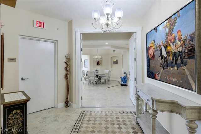 entryway with a notable chandelier