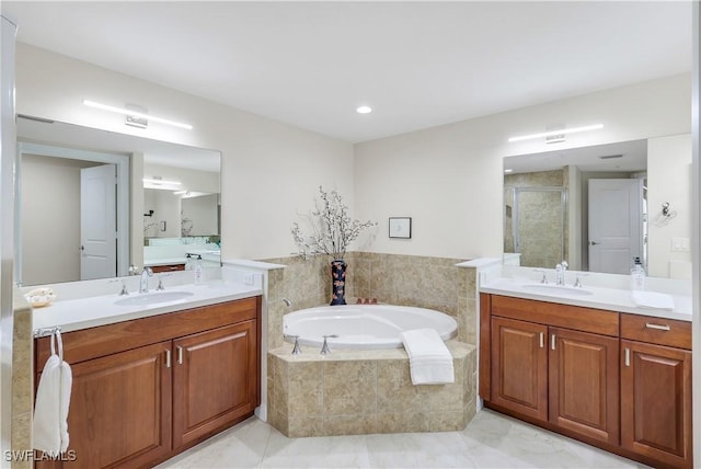 bathroom featuring separate shower and tub, tile patterned floors, and vanity