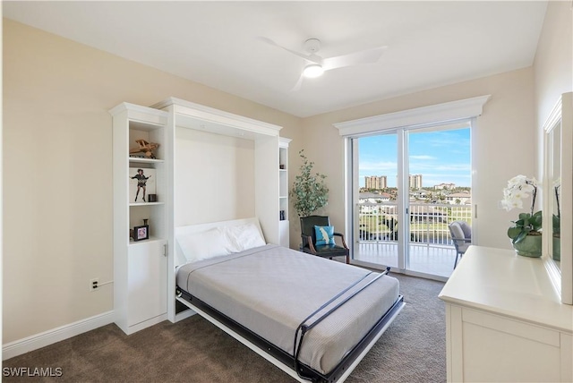 bedroom featuring ceiling fan, dark carpet, and access to exterior