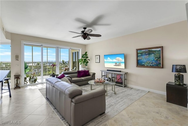 tiled living room with ceiling fan