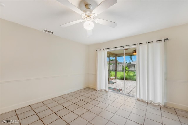 unfurnished room with ceiling fan and light tile patterned floors