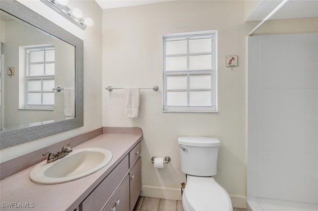 bathroom featuring tile patterned floors, walk in shower, vanity, and toilet