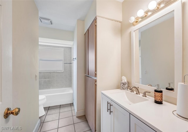 full bathroom with tile patterned floors, vanity, toilet, and tiled shower / bath combo