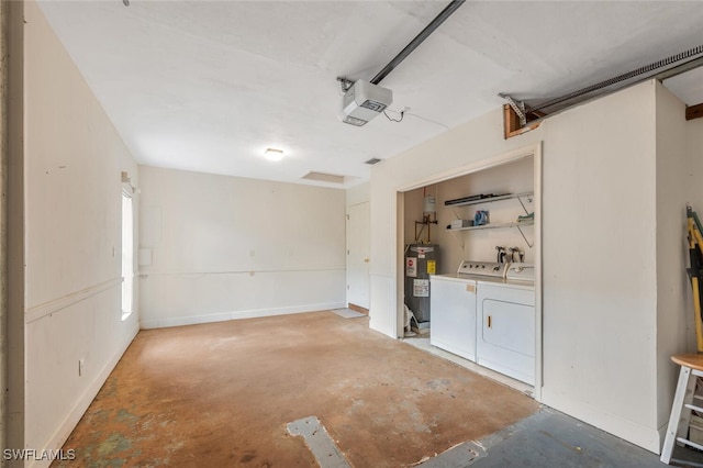 garage featuring separate washer and dryer, water heater, and a garage door opener