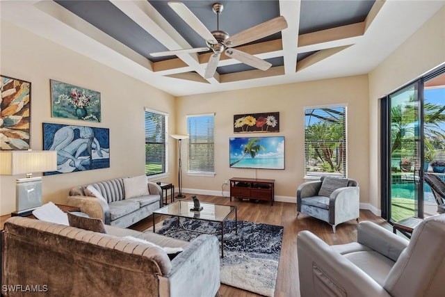 living room featuring beam ceiling, hardwood / wood-style flooring, ceiling fan, and coffered ceiling