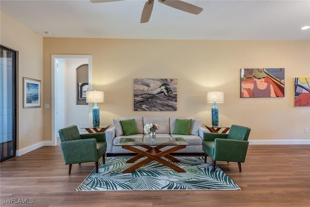 living room with hardwood / wood-style floors and ceiling fan