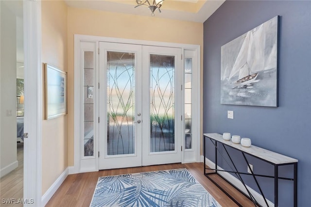 entryway featuring light hardwood / wood-style floors and french doors