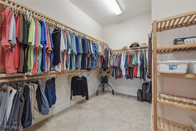 spacious closet featuring tile patterned flooring