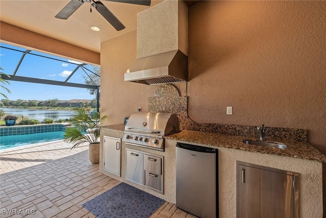 8464 Palacio Ter W, Naples, FL 34114 - view of patio with a grill, area for grilling, a sink, ceiling fan, and a water view