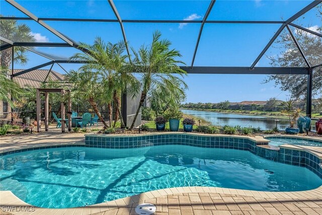 8464 Palacio Ter W, Naples, FL 34114 - view of pool featuring a patio, glass enclosure, a water view, and a pool with connected hot tub