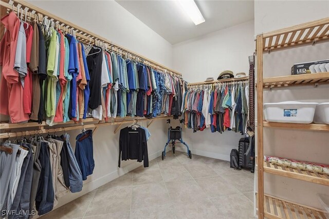 8464 Palacio Ter W, Naples, FL 34114 - walk in closet featuring tile patterned flooring