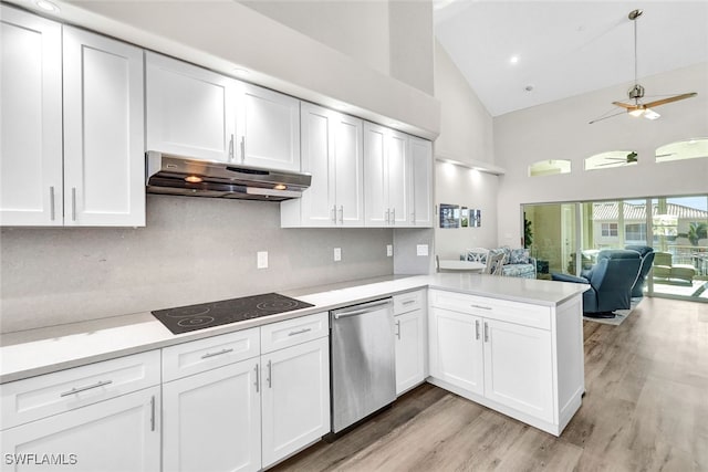 kitchen with black electric stovetop, ceiling fan, dishwasher, high vaulted ceiling, and white cabinets