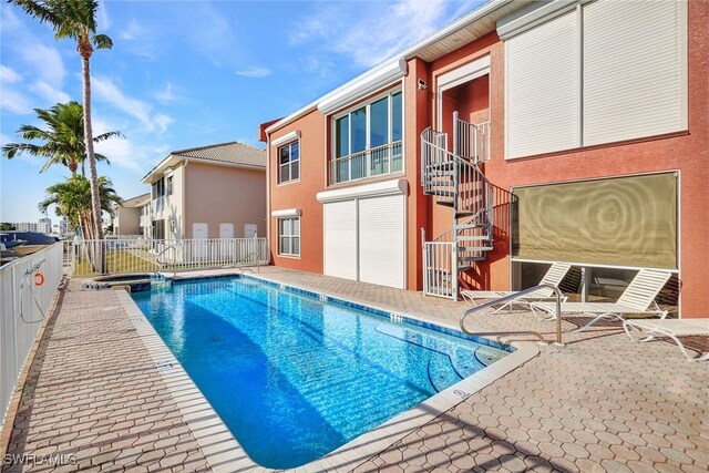 view of pool featuring a patio