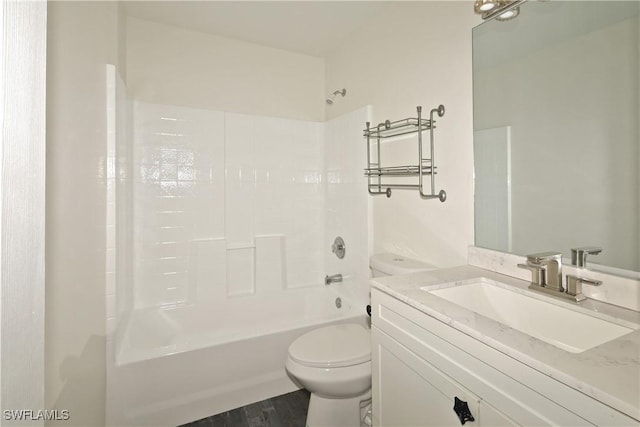 full bathroom featuring vanity, hardwood / wood-style flooring, toilet, and shower / washtub combination